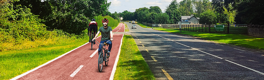 cyclist cyling on artists impression of cycle path